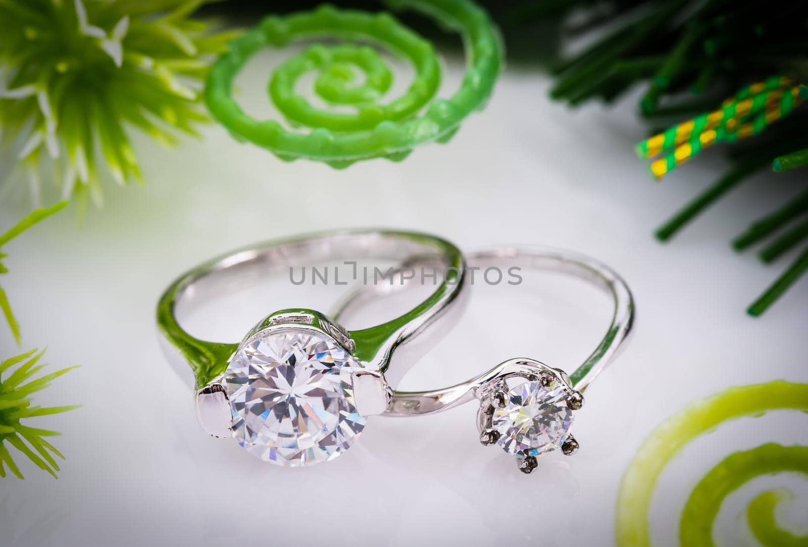 Diamond wedding rings on white background by stoonn