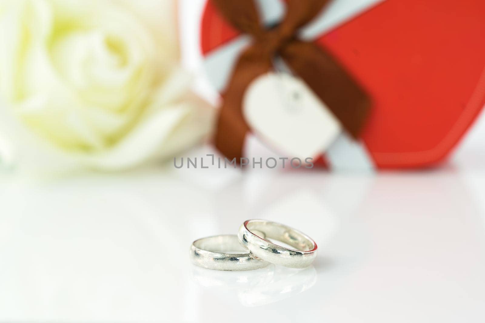 White rose and heart-shaped box on white background, Valentine'sDay concept