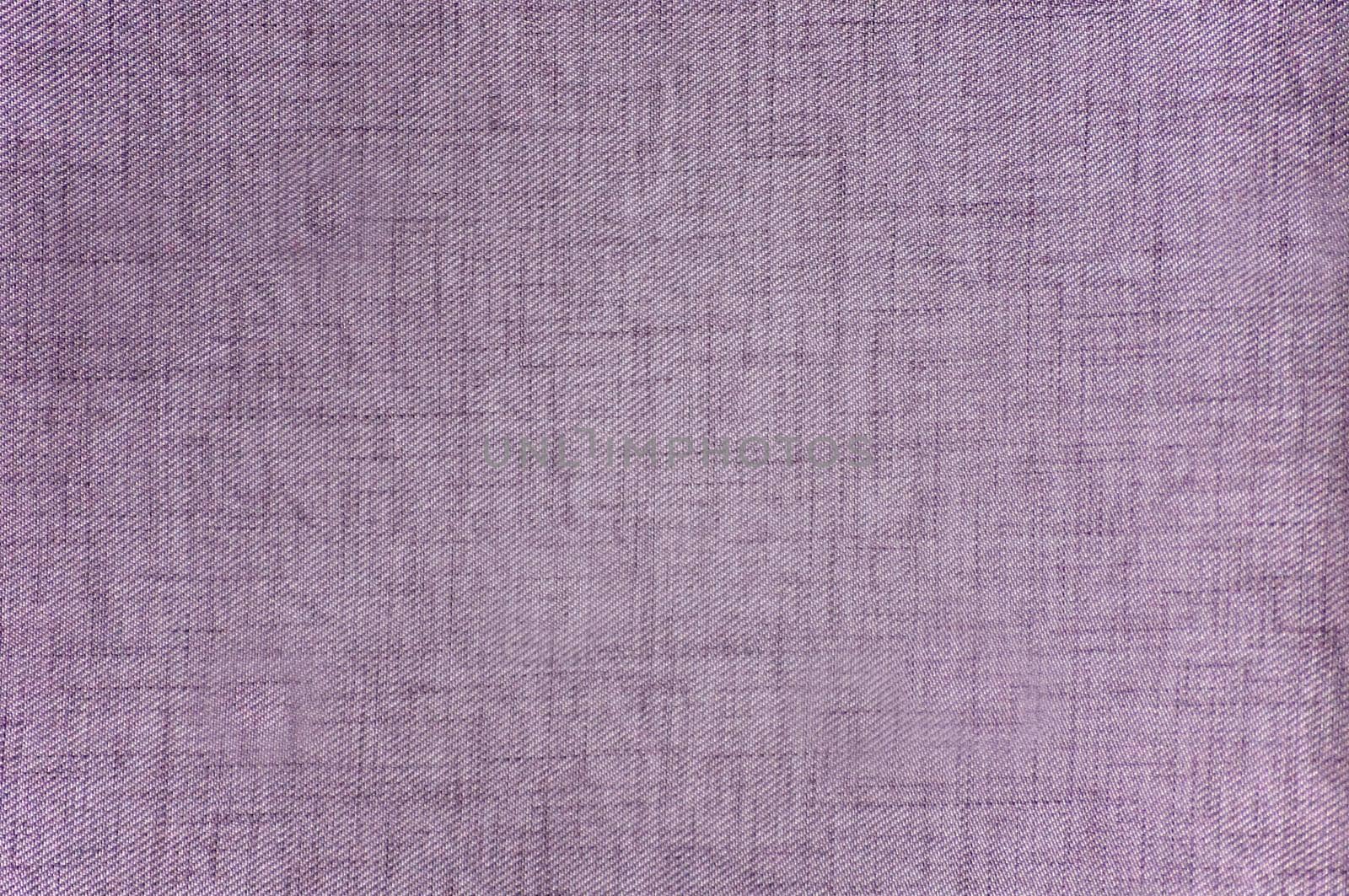 The fabric is purple in color with a textured rough surface close-up.Texture or background