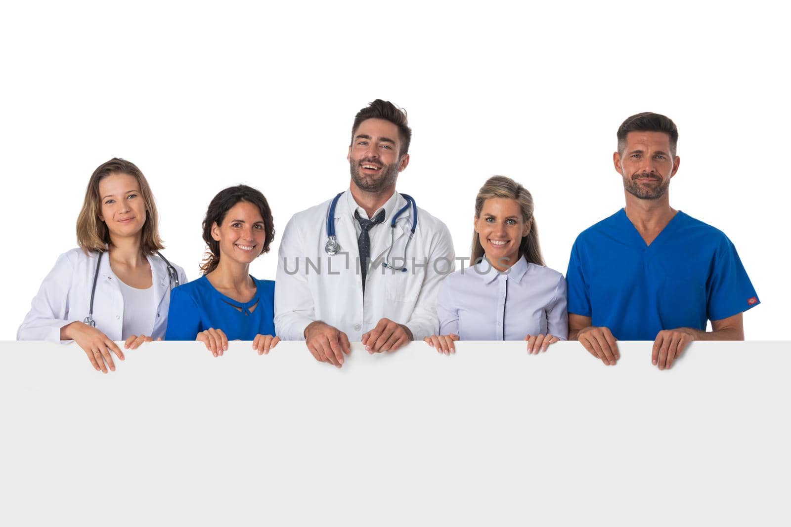 Group of smiling medical doctors with empty banner. Isolated over white background