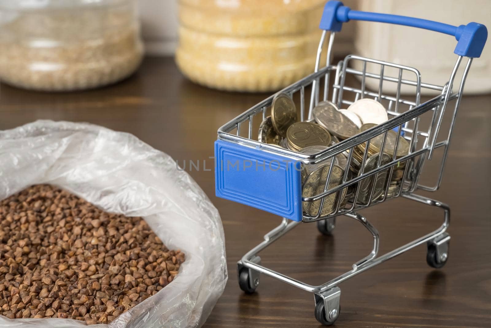 Kazakhstani tenge KZT in a grocery basket with bread, buckwheat grain and cereals. Rising prices for food and groceries in Kazakhstan and other countries. Humanitarian aid. by YevgeniySam