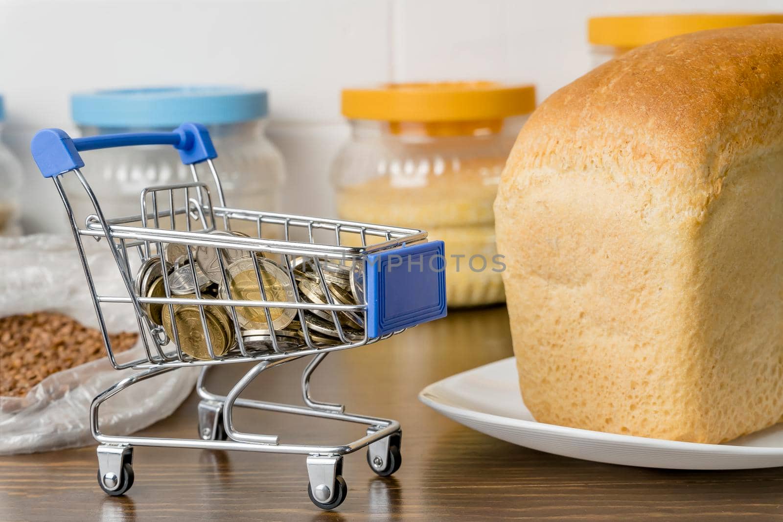 Kazakhstani tenge KZT in a grocery basket with bread, buckwheat grain and cereals. Rising prices for food and groceries in Kazakhstan and other countries. Humanitarian aid.