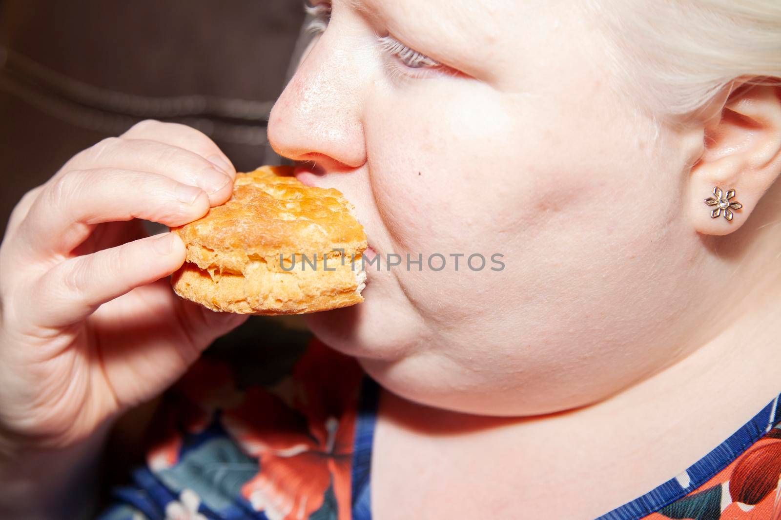 Woman Eating Buttermilk Biscuit by tornado98