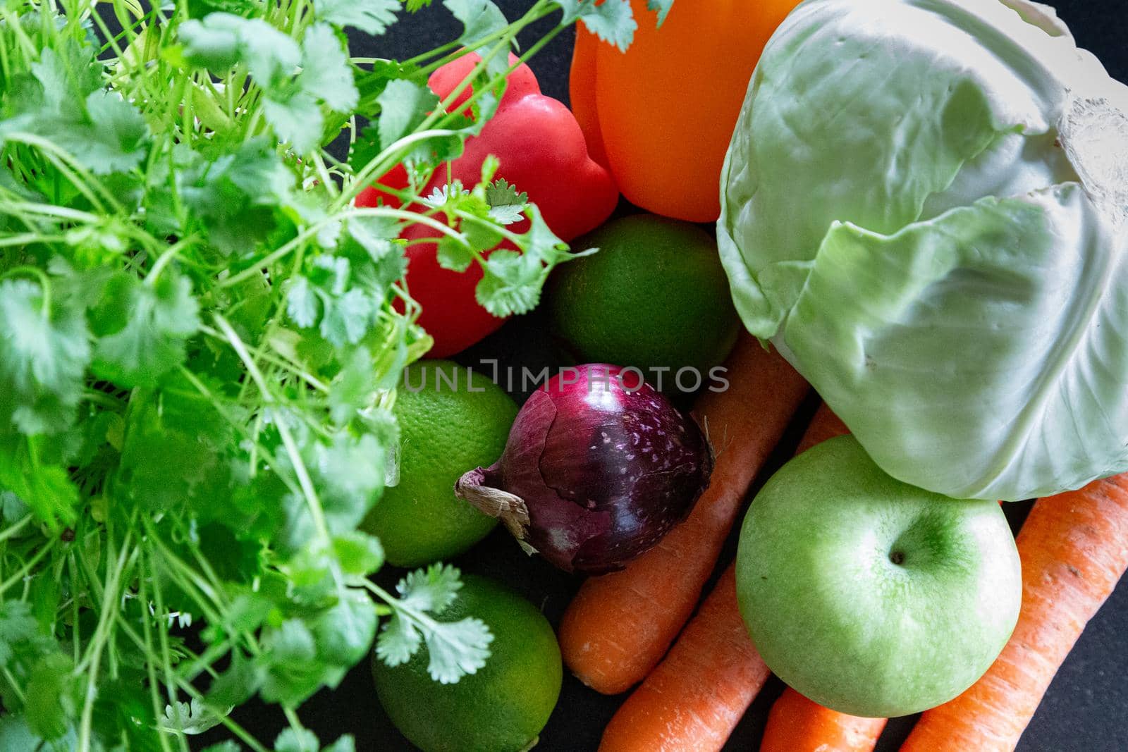 Composition with vegetables and fruit unions, apple, carrot, lemon, orange, bell peppers