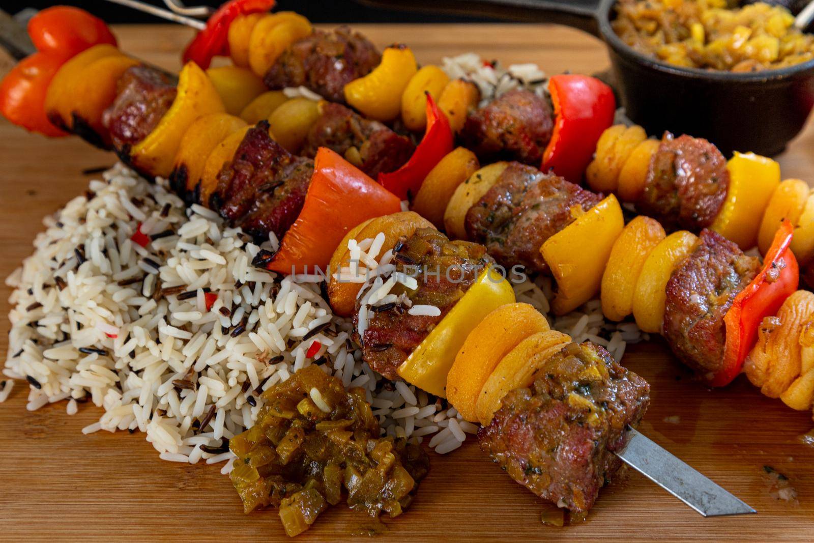 South African fillet of lamb on a skewer with wild rice