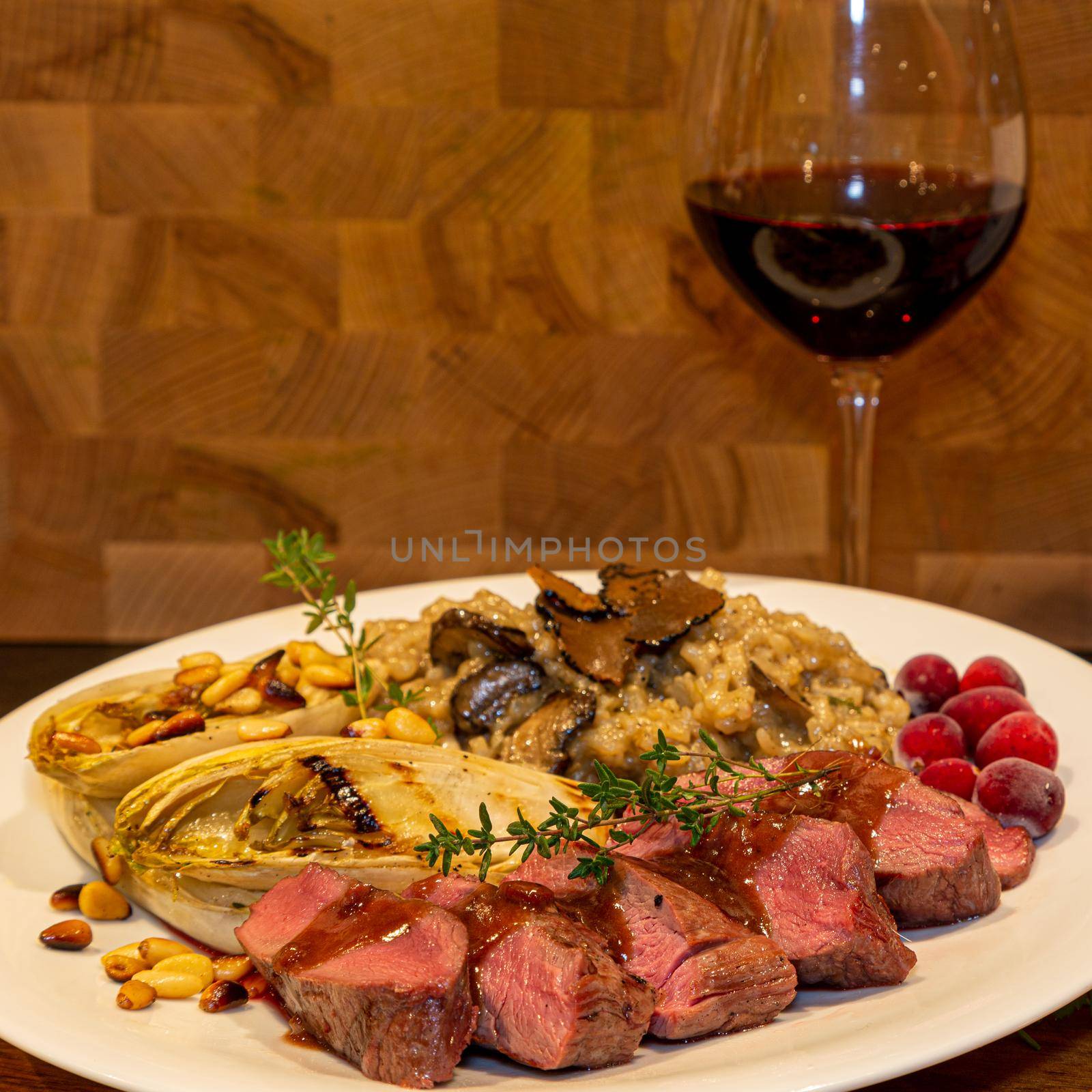 Grilled venison fillet with truffle risotto, bittersweet grilled chicory and a classic red wine sauce by mlechanteur