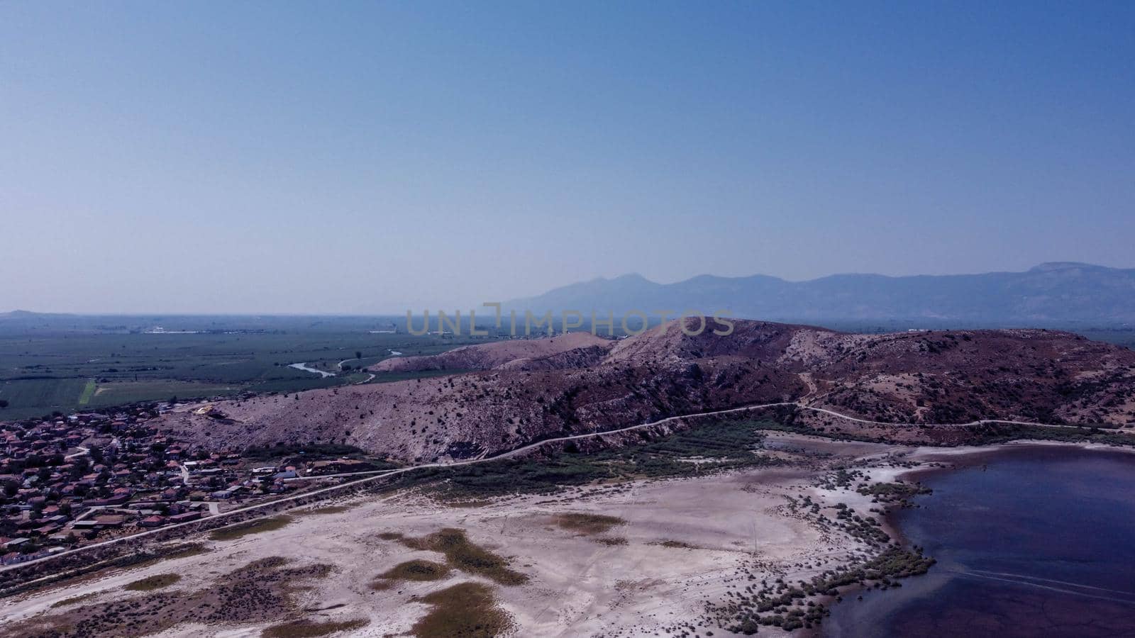 a very good looking horizontal landscape drone shoot with vivid colors - there is lake and blue sky red color dominant. photo has taken at bafa lake in turkey.