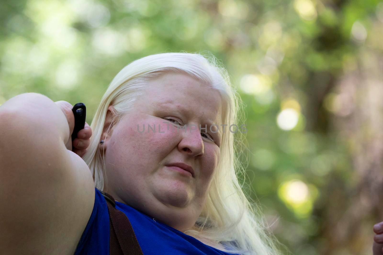 Albino Woman Brushing Her Hair in Nature by tornado98
