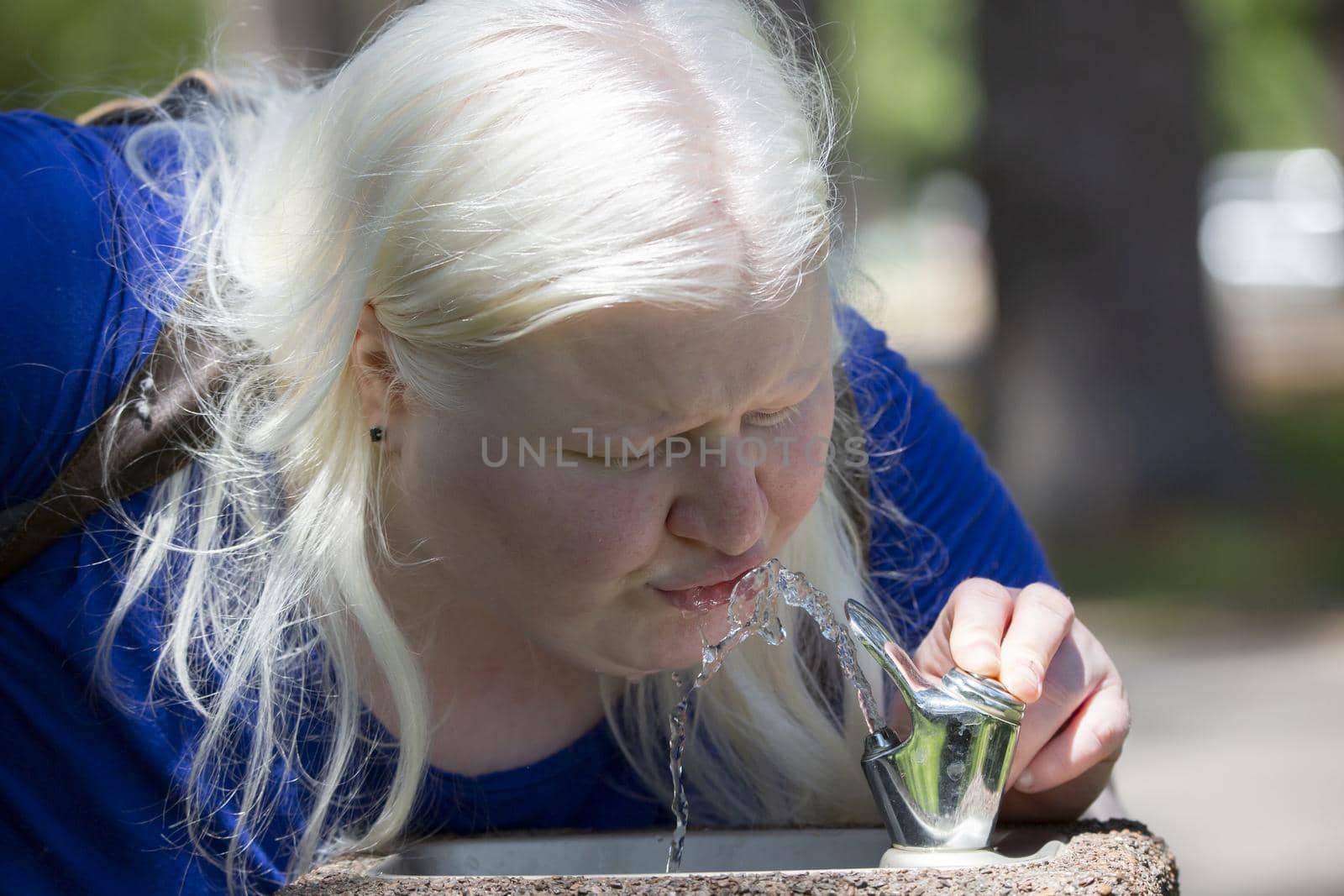 Woman Drinking from Fountain by tornado98