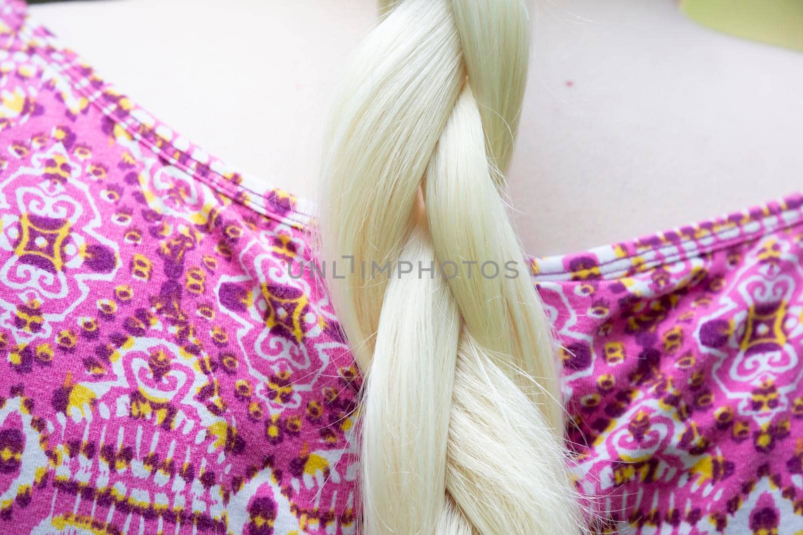 Close up of braided pleats in white hair