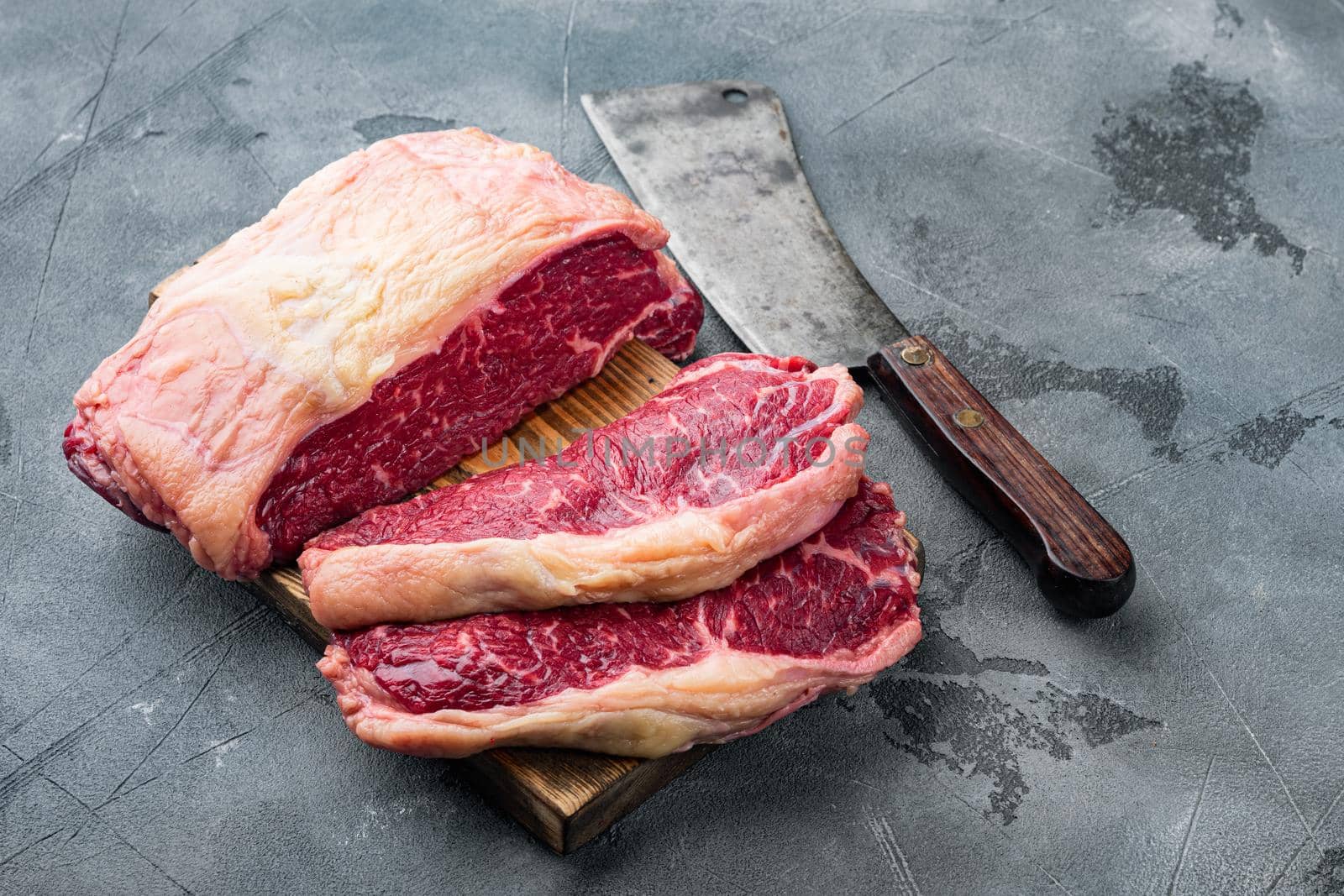 Top loin, fresh organic beef meat cut, on gray background