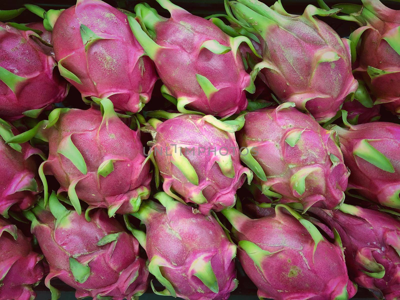 Dragon fruit in the market in thailand by NarinNonthamand