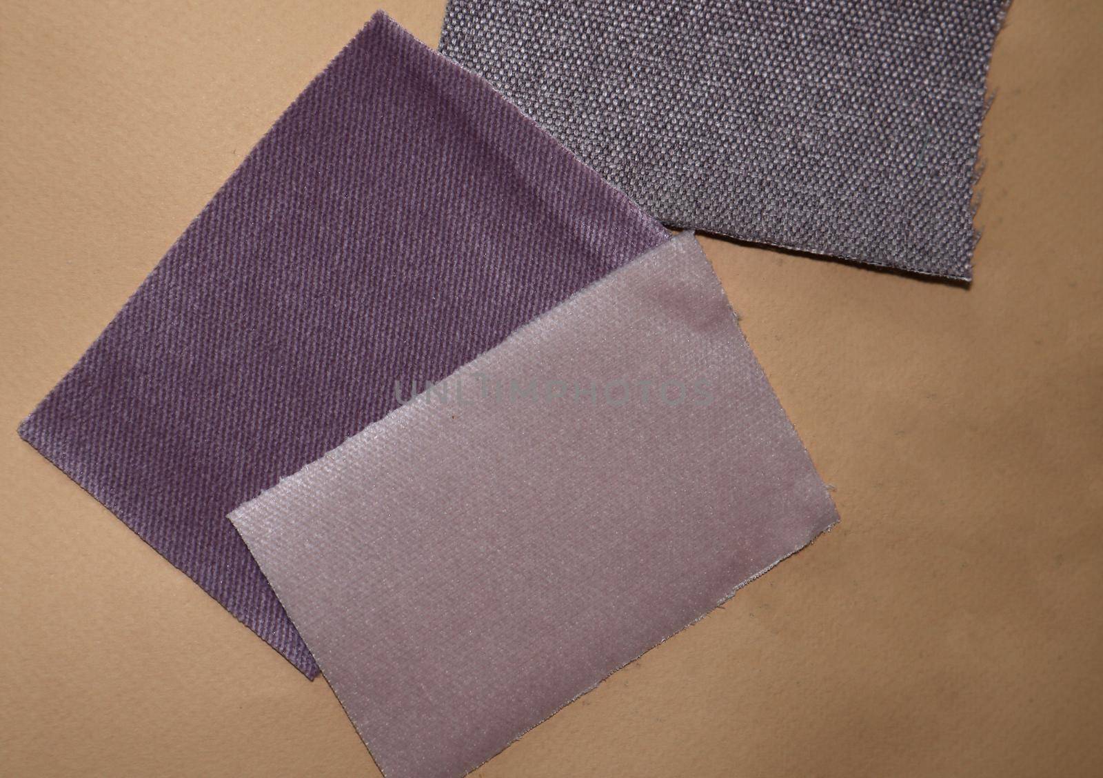 Fabric samples on a light brown background by SemFid