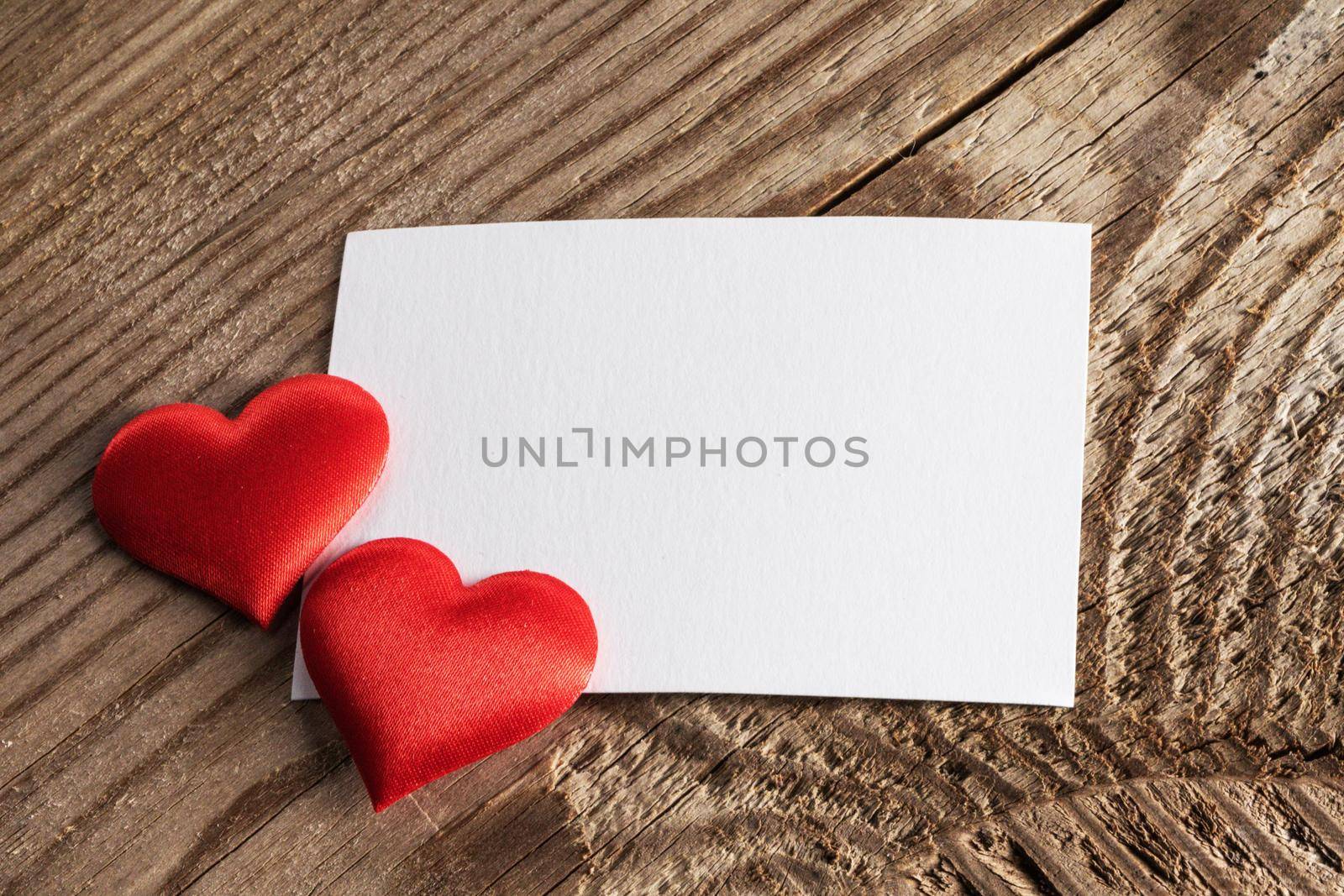 Valentine's day white blank paper greeting card and red silk hearts, background border frame with copy space, love concept