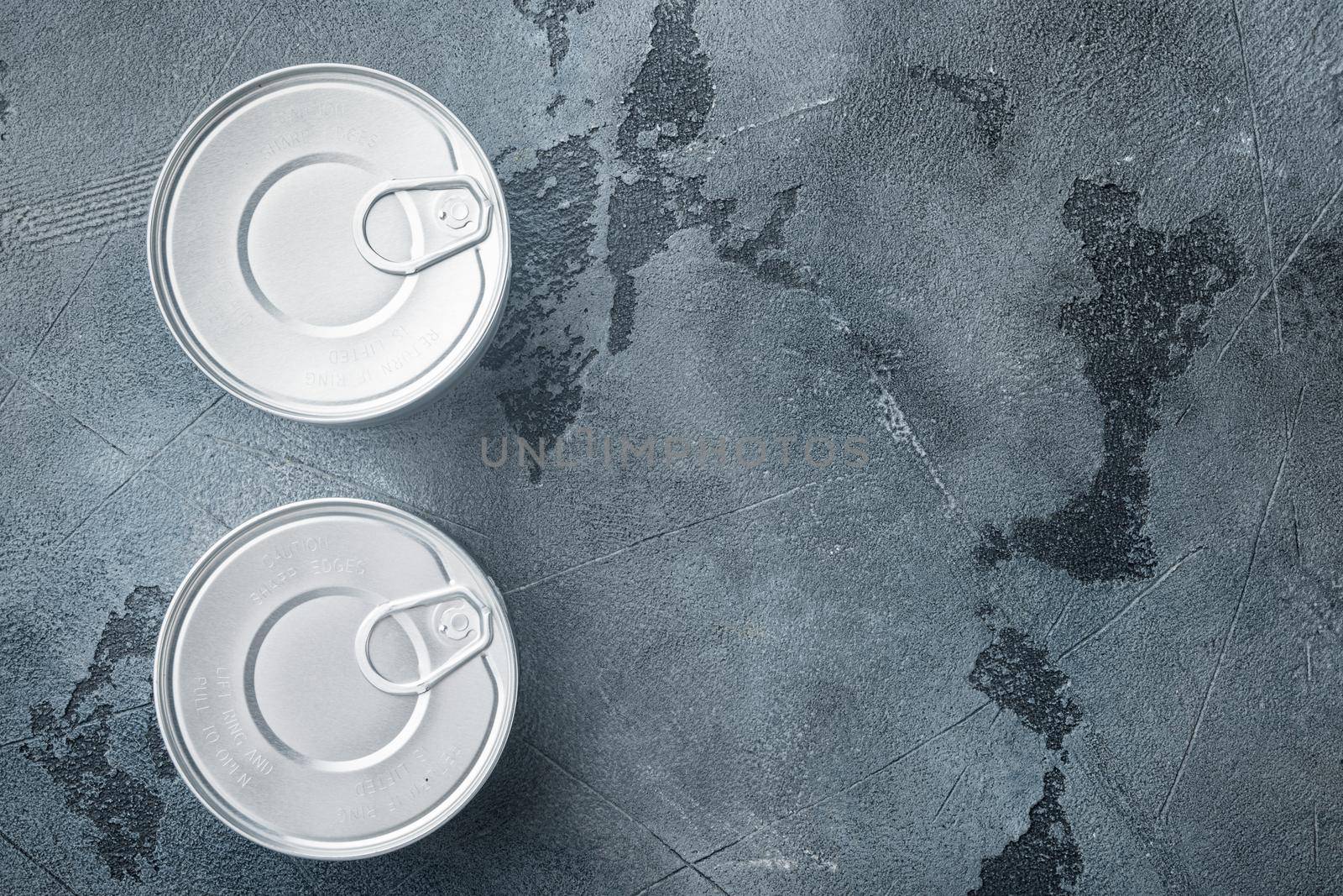 Canned sauce tin can, on gray background, top view or flat lay with copy space for text