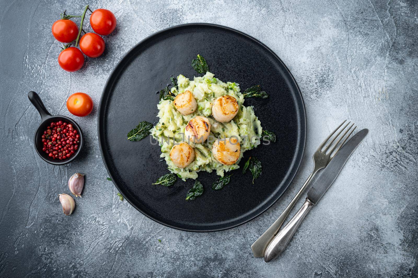 Sizzling seared scallops grilled meal, top view, on grey background
