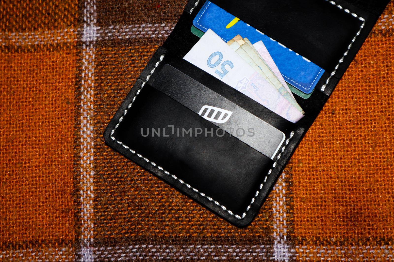 Leather wallet with cards and money by SemFid