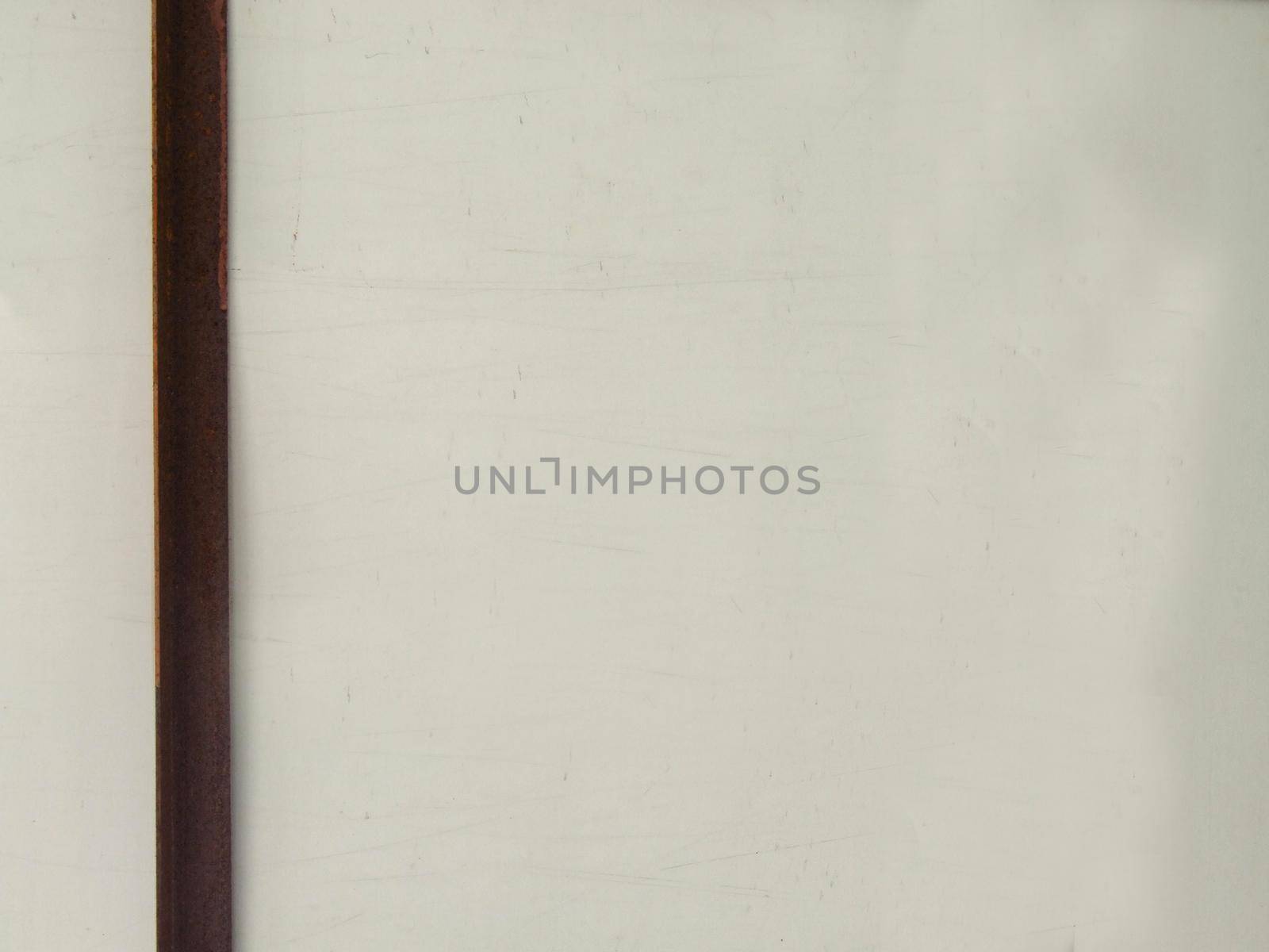 Horizontal metal rusty plate on a light background close-up.Texture or background