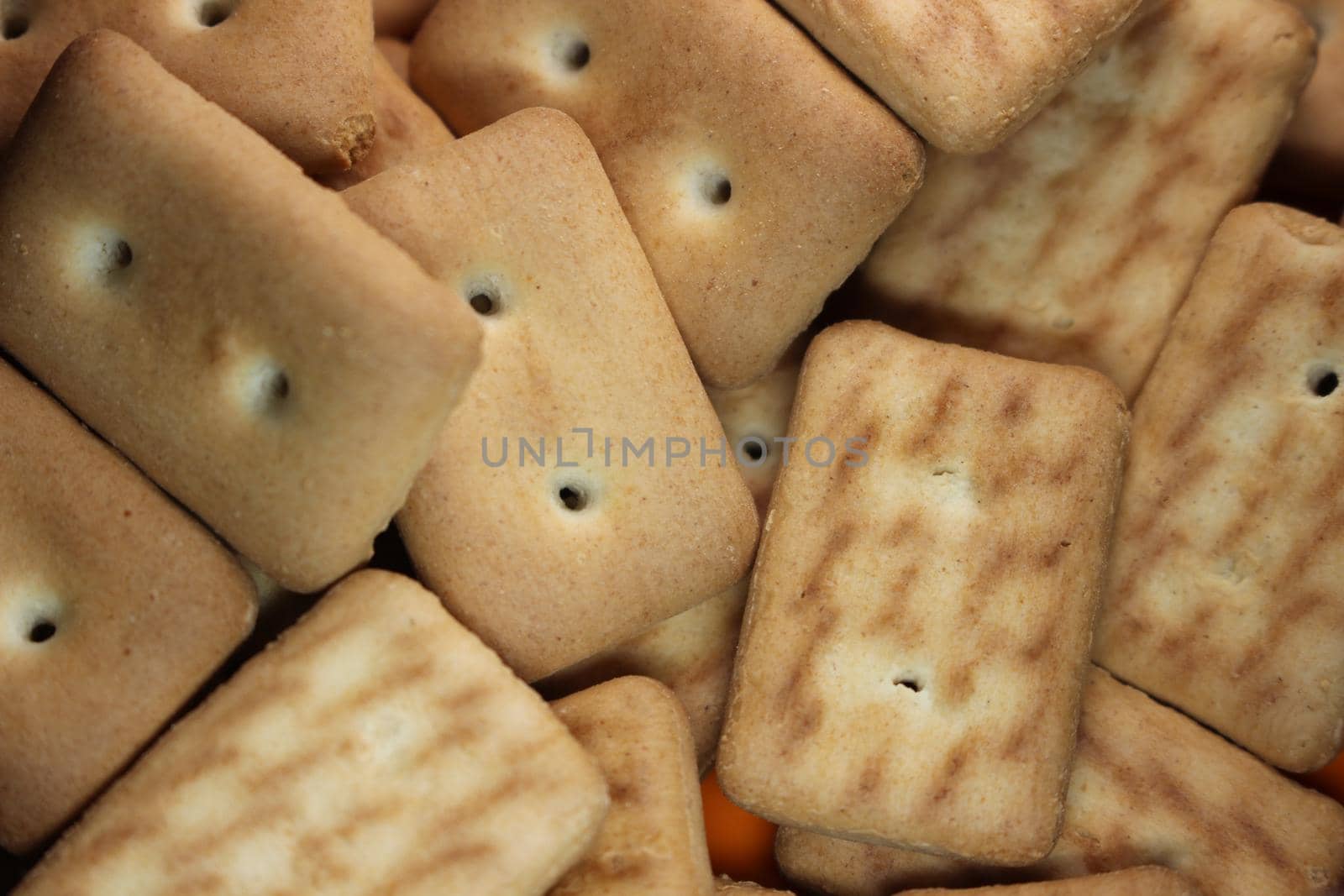 Close up top view of of biscuit cookies. Close up view rectangular biscuits with small pores