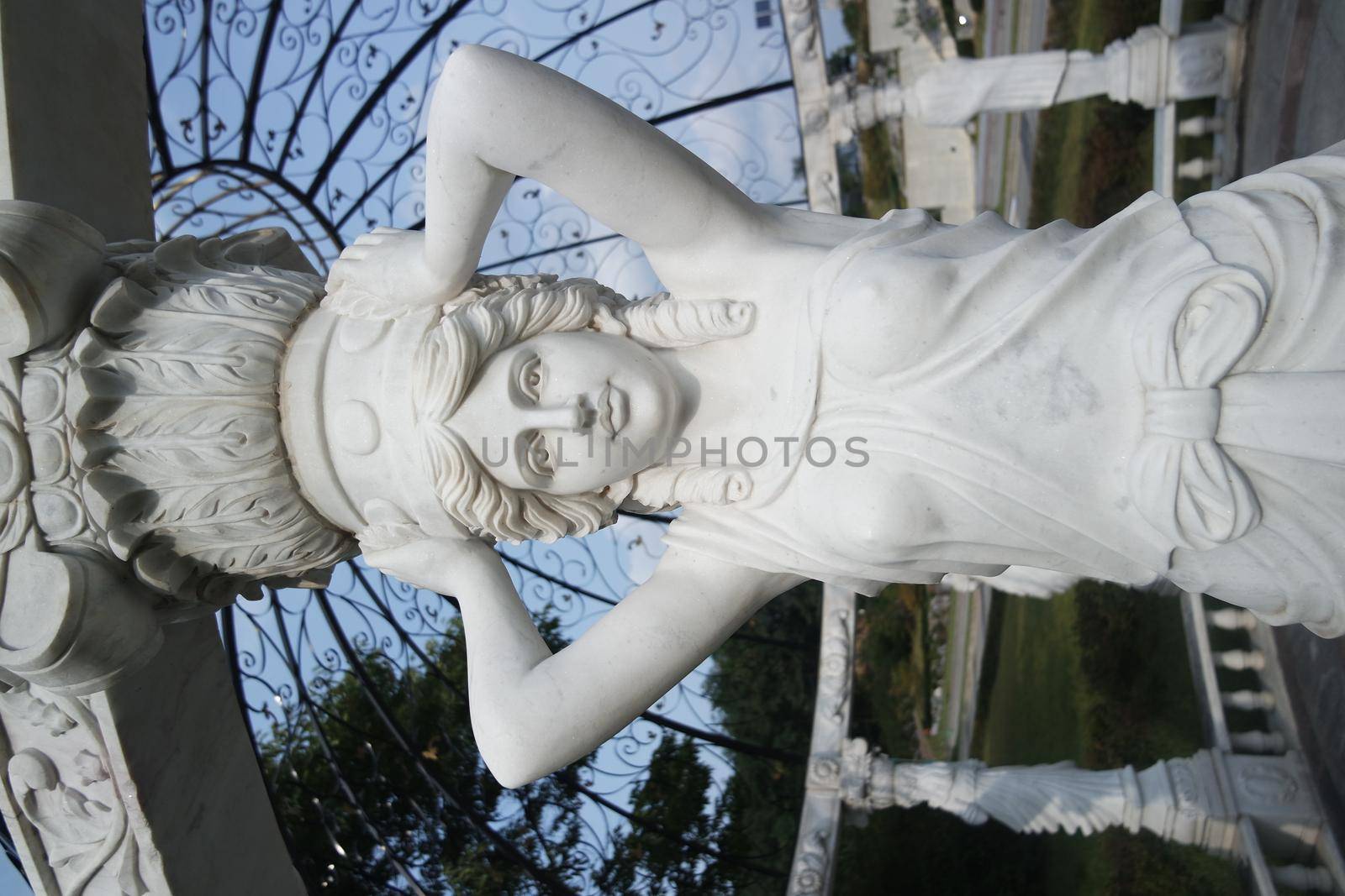 Statue of Greek Goddess Head with lovely hair settled in a public park by Photochowk