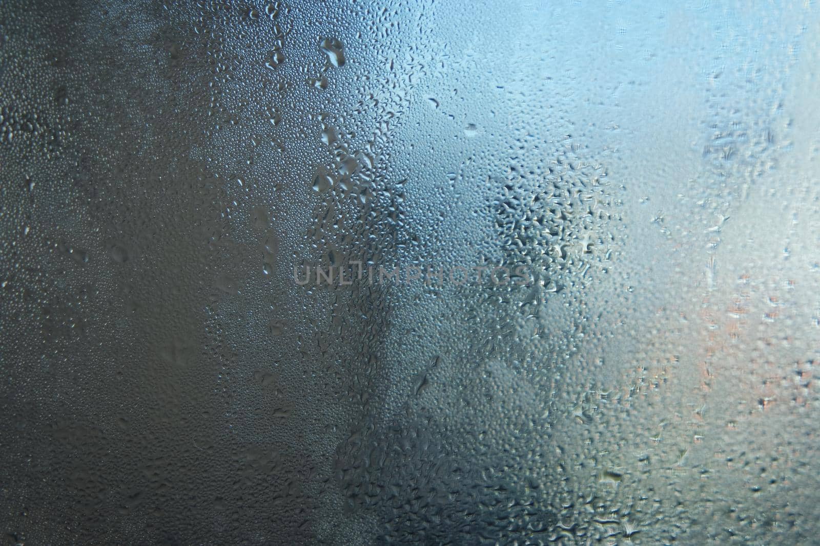 Bright grey color glassy texture, with water drops on it: abstract background