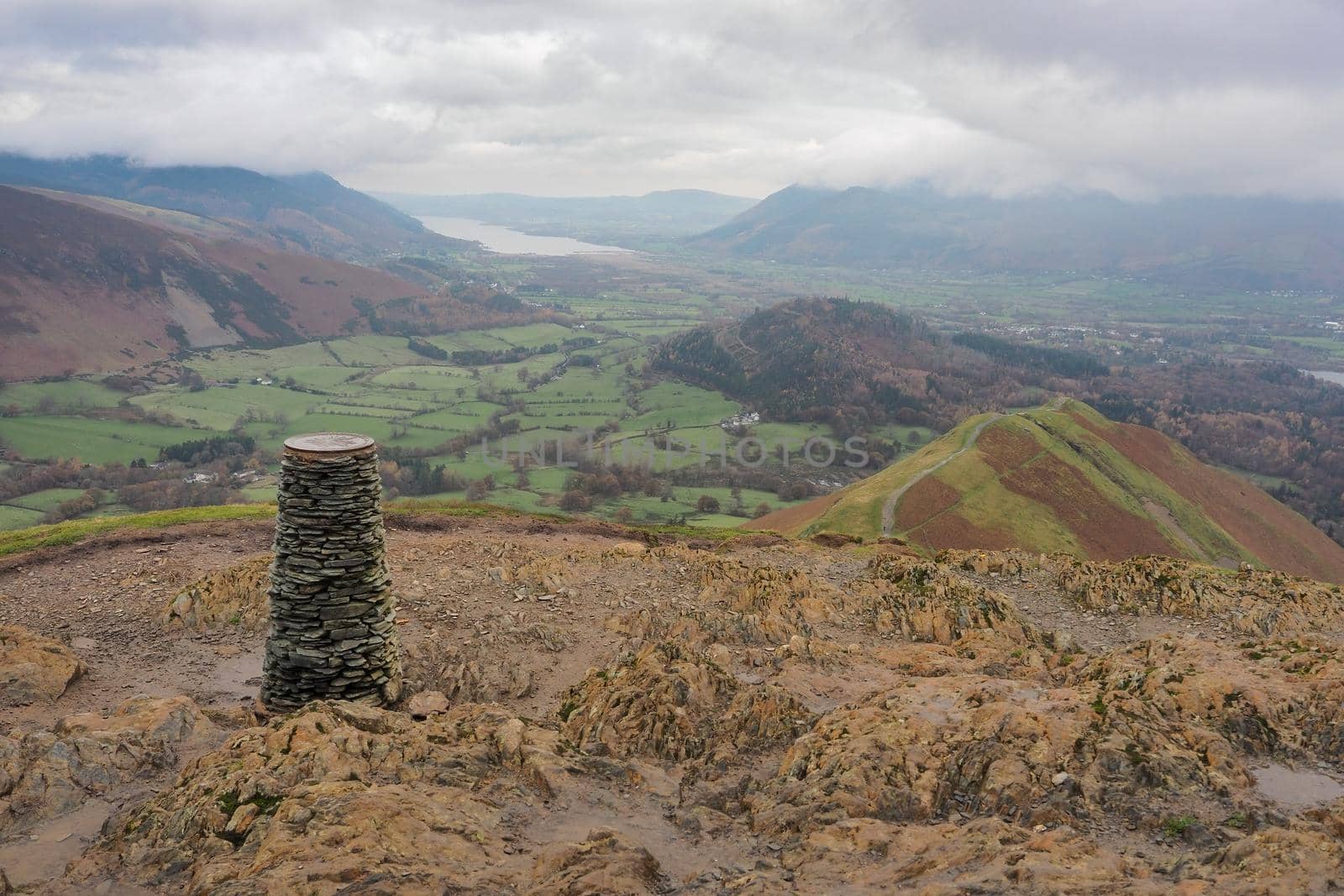 View from the triangulation point at the summit of Cat Bells looking over Skelgill Bank with Bassenthwaite Lake in the distance, Lake District, UK