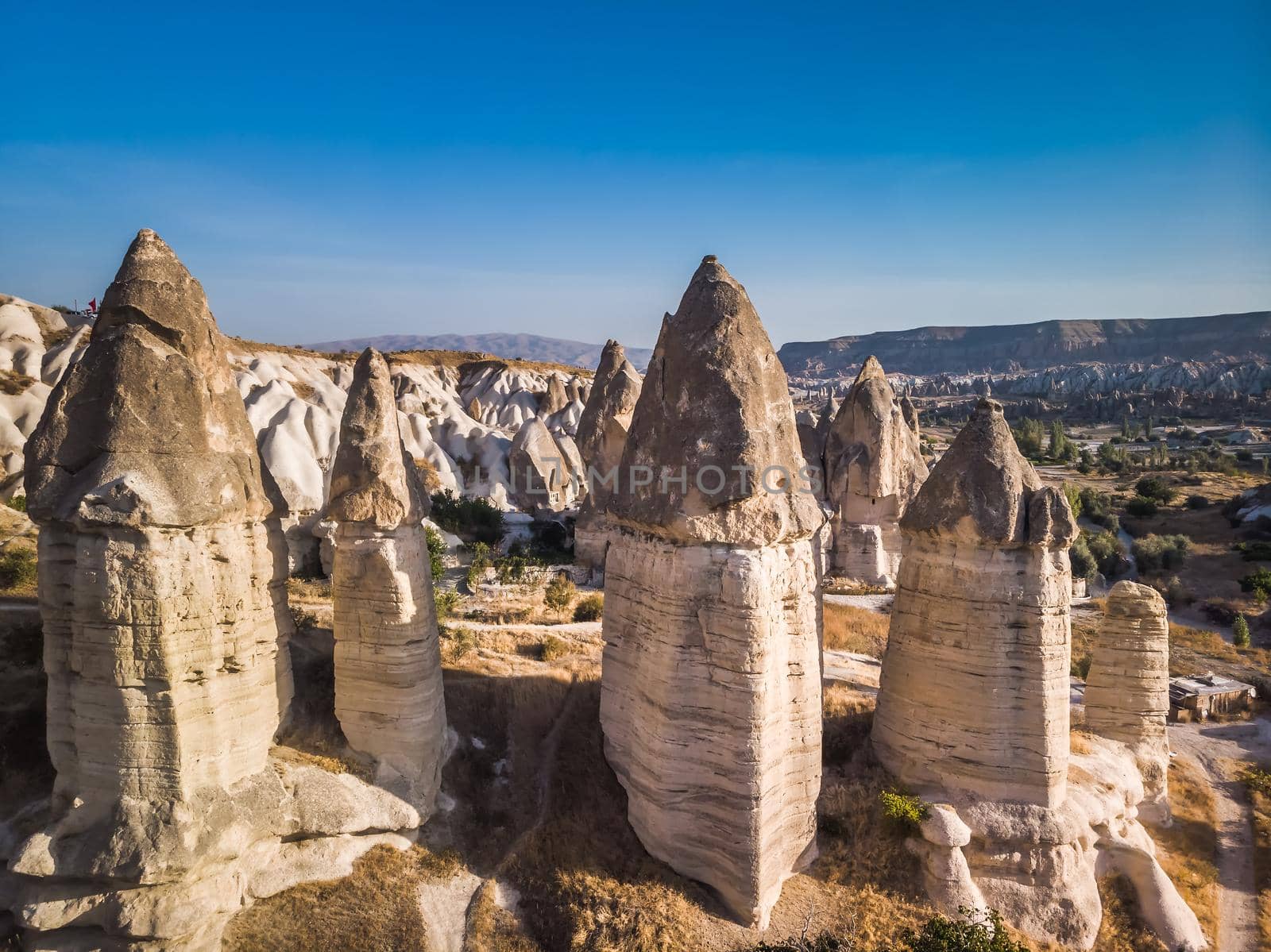 Aerial drone view of the fairy chimney landscape in Love Valley of Cappadocia in Goreme, Turkey.