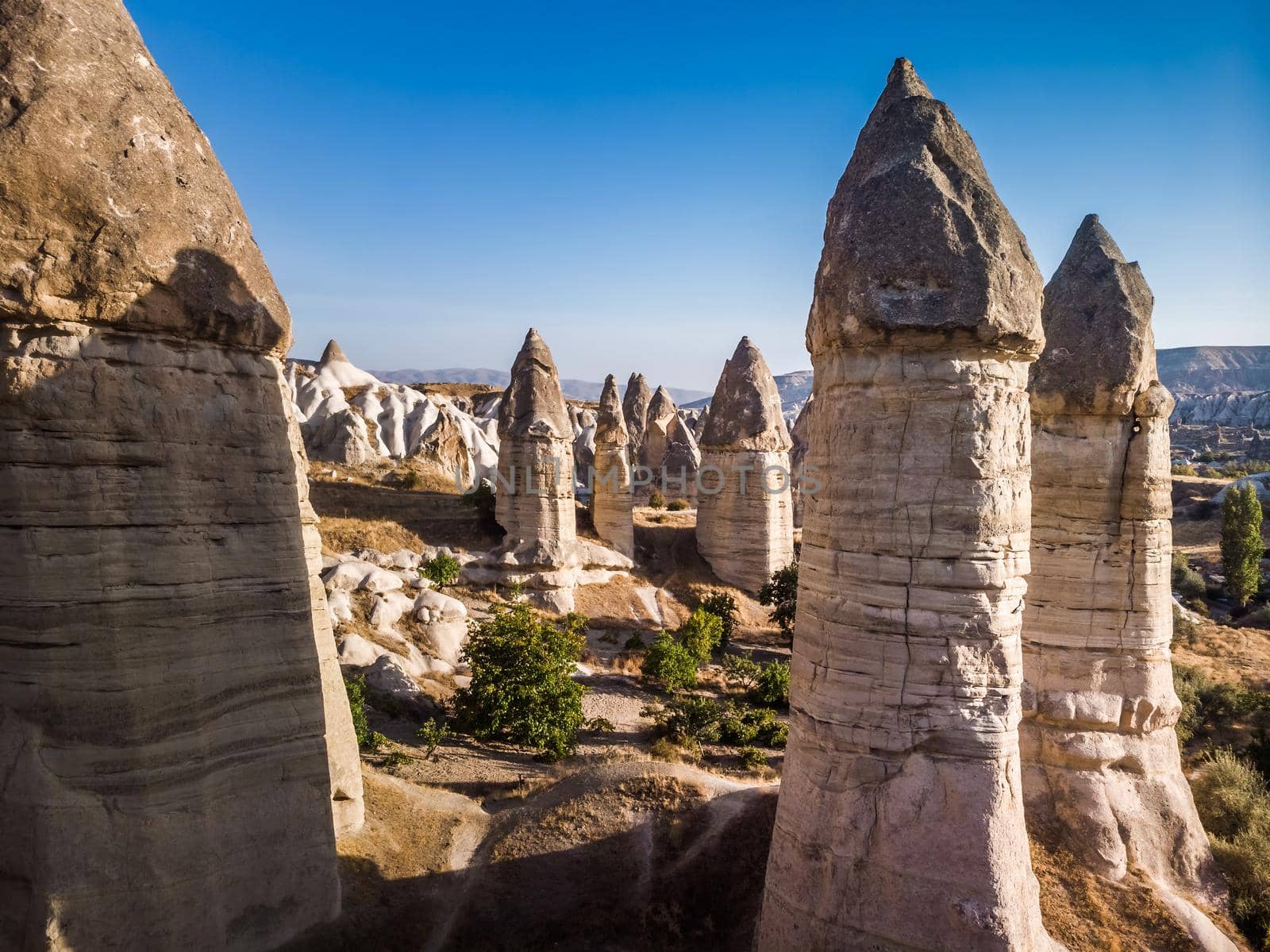 Aerial drone view of the fairy chimney landscape in Love Valley of Cappadocia in Goreme, Turkey.