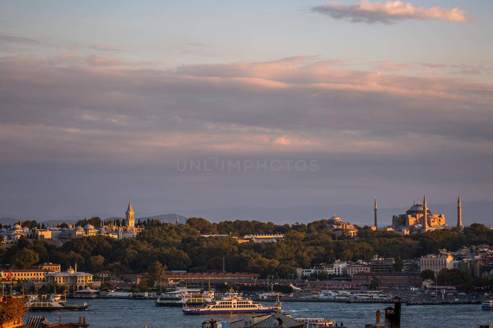 Istanbul sunset skyline panoramic view of Istanbul Turkey. Beautiful Bosphorus with mosques at the background.