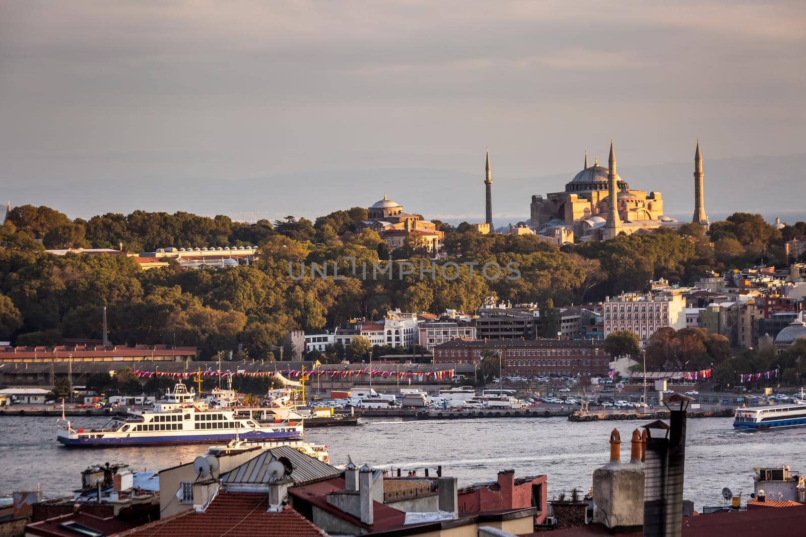 Istanbul sunset skyline panoramic view of Istanbul Turkey. Beautiful Bosphorus with mosques at the background.