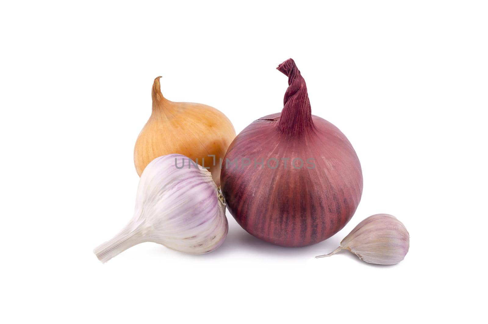 Garlic bulbs and cloves, golden-brown and red onion isolated on white background