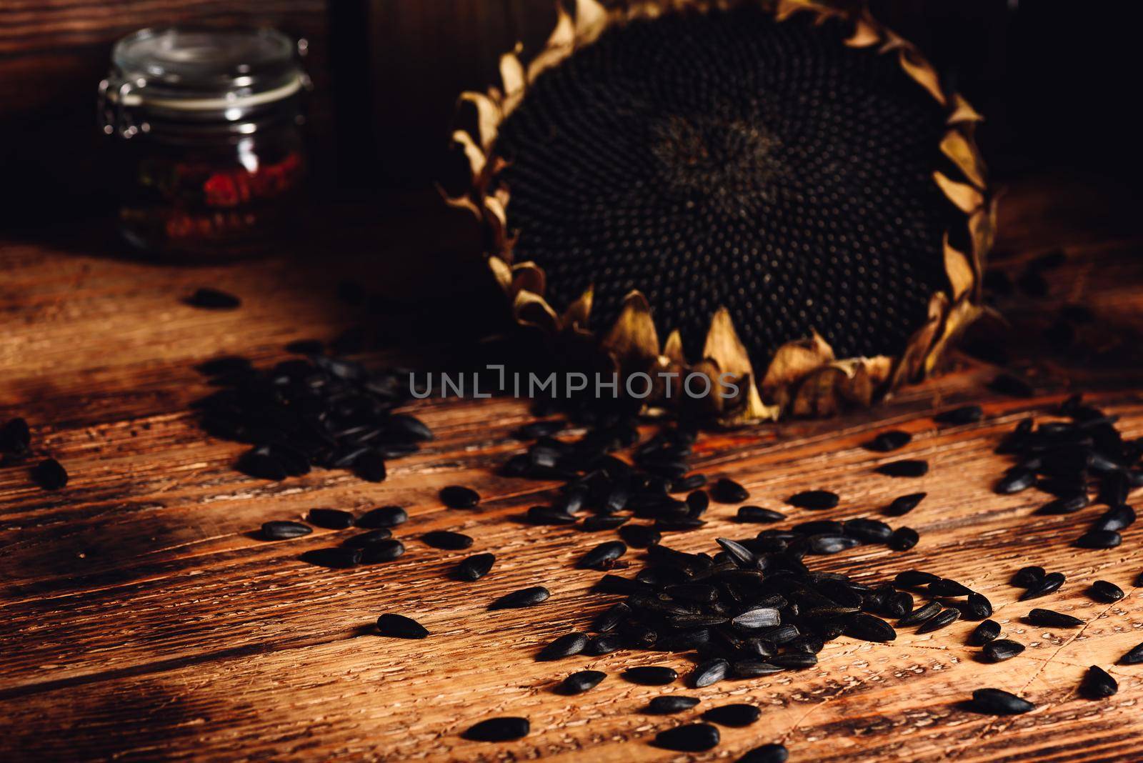 Dried sunflower and roasted seeds on the old wooden table