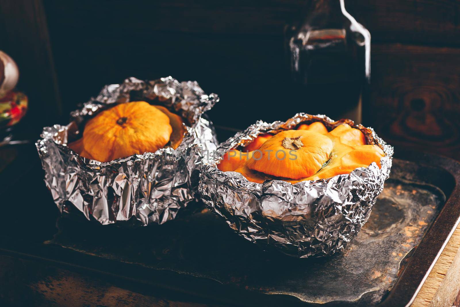 Two pattypan squash stuffed with minced meat on baking tray