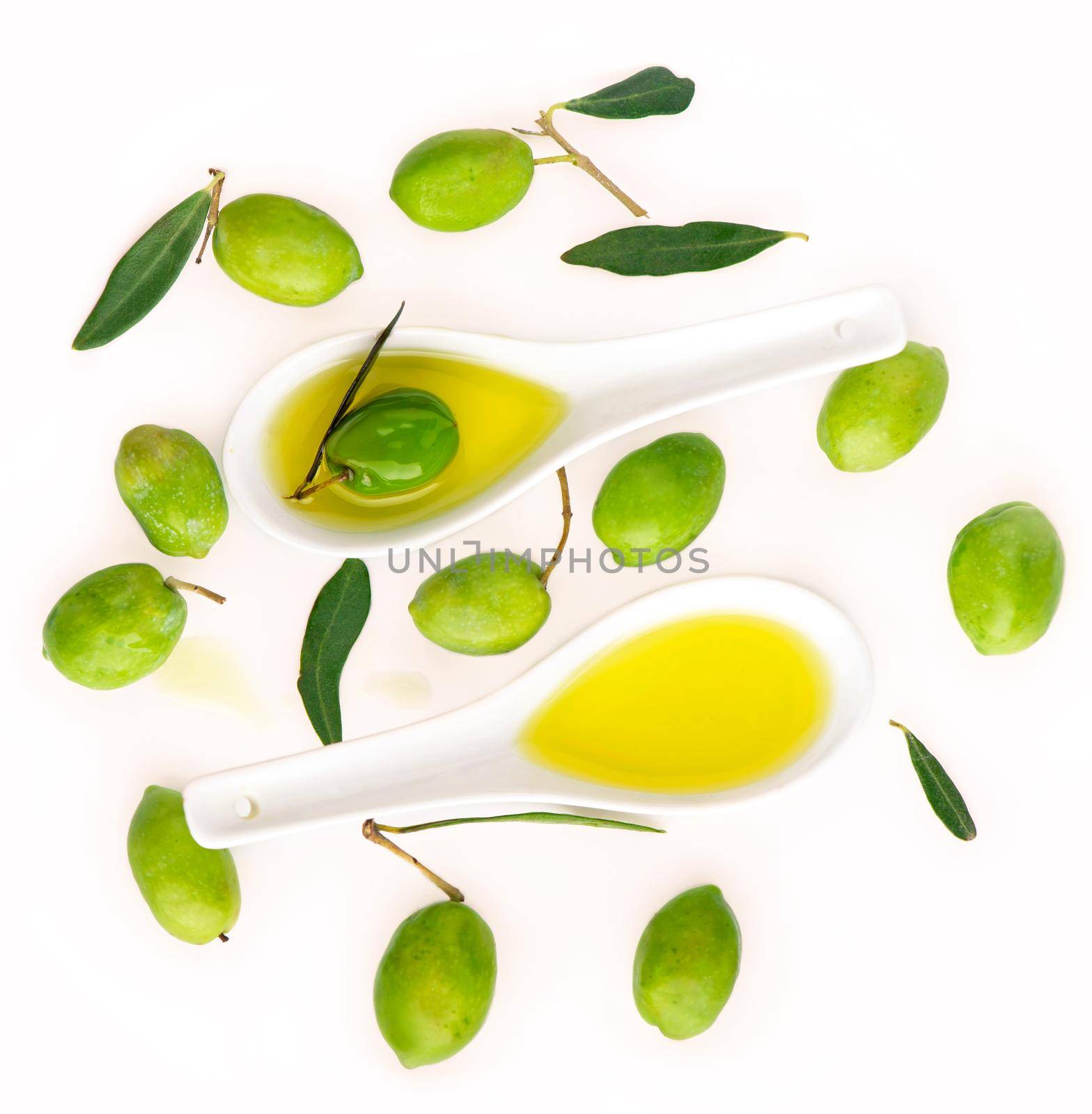 Olive fruit and olive leaves on a white background by aprilphoto