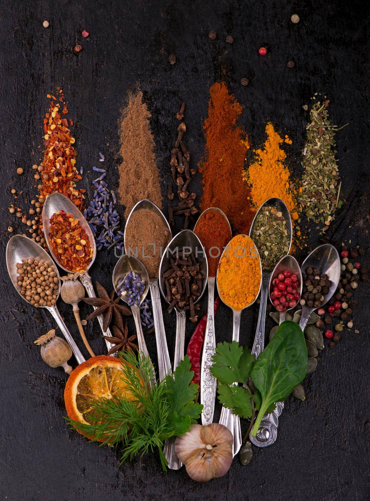 Various spices spoons on stone table. Top view with copy space by aprilphoto