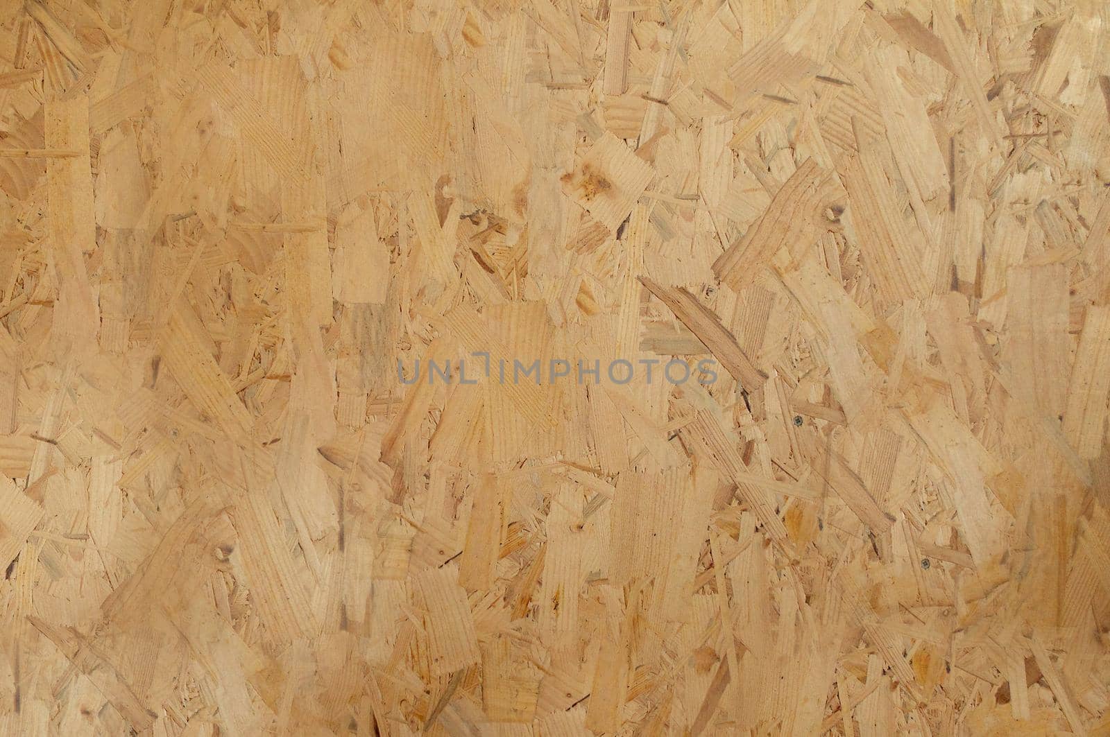 Yellow patterned plywood texture close up with blurred part of frame.Texture or background