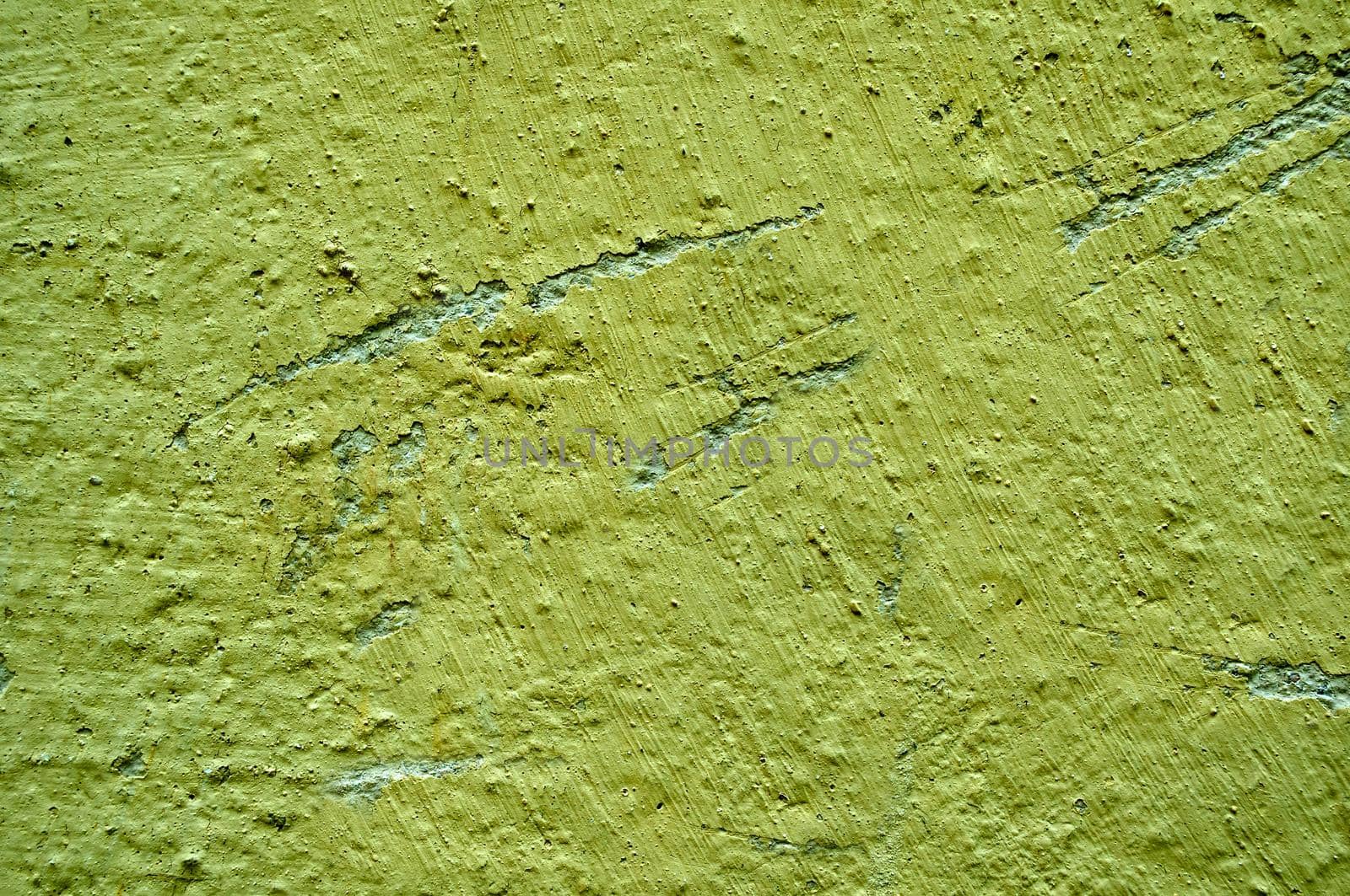 The old wall surface is green with irregularities and roughness.Texture or background