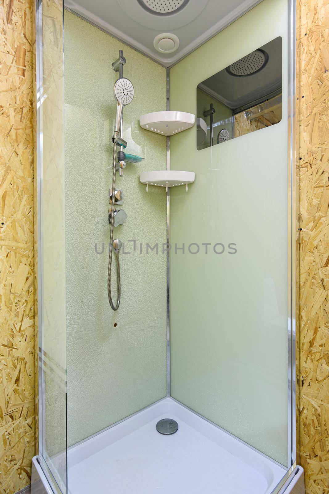 Shower stall with cracked glass, located in a country house