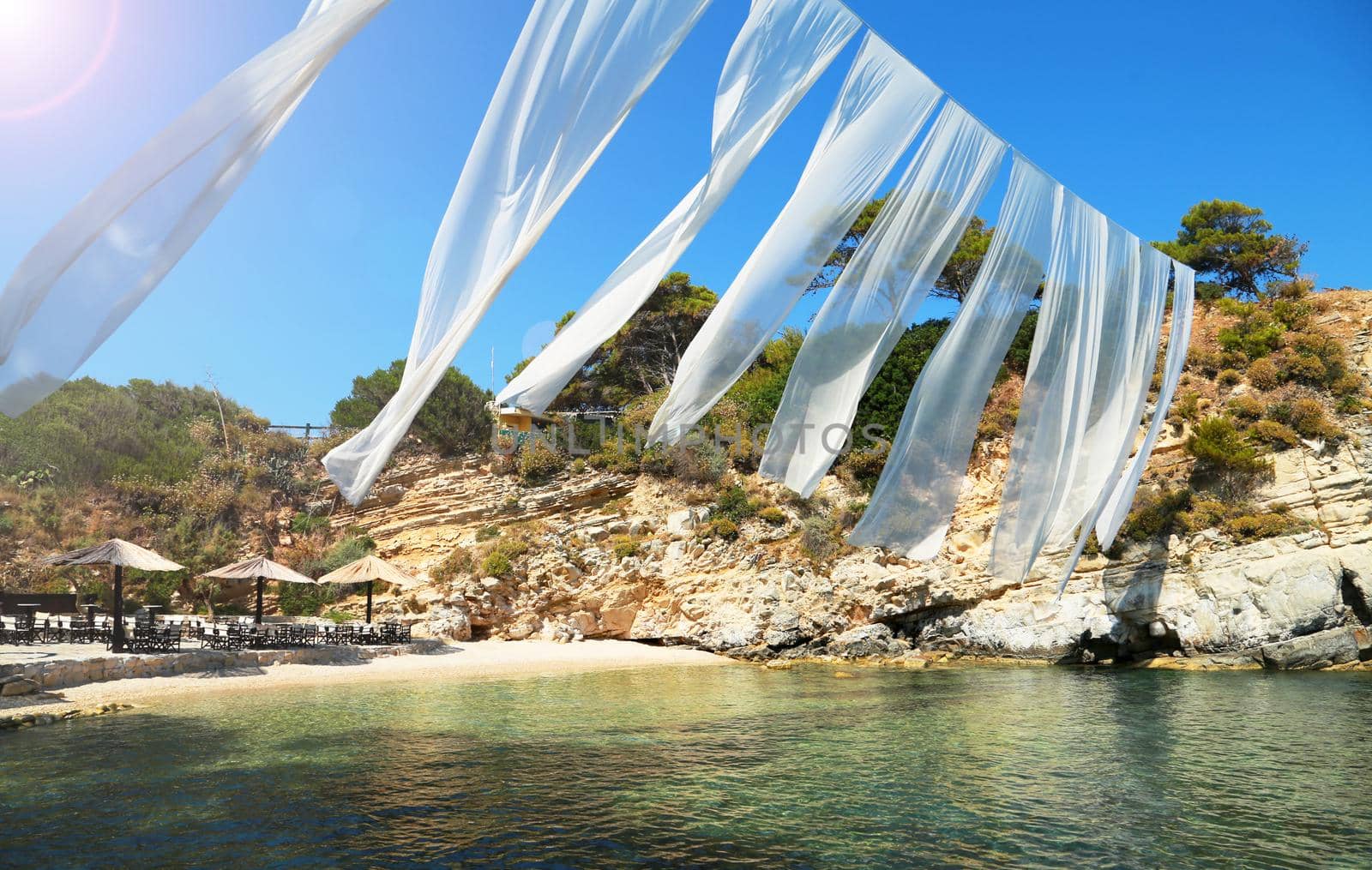 Summer sea resort, beach. Summer beach with sand, sea and white sail. Summer vacation travel holiday background concept. Greece Zakynthos