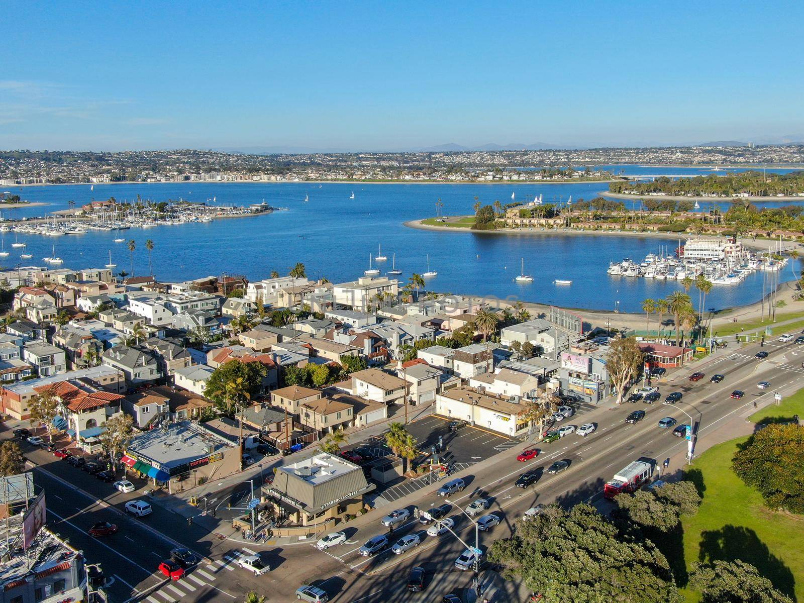 Aerial view of Mission Bay and Beaches in San Diego, California. USA. Community built on a sandbar with villas, sea port and recreational Mission Bay Park. Californian beach lifestyle.