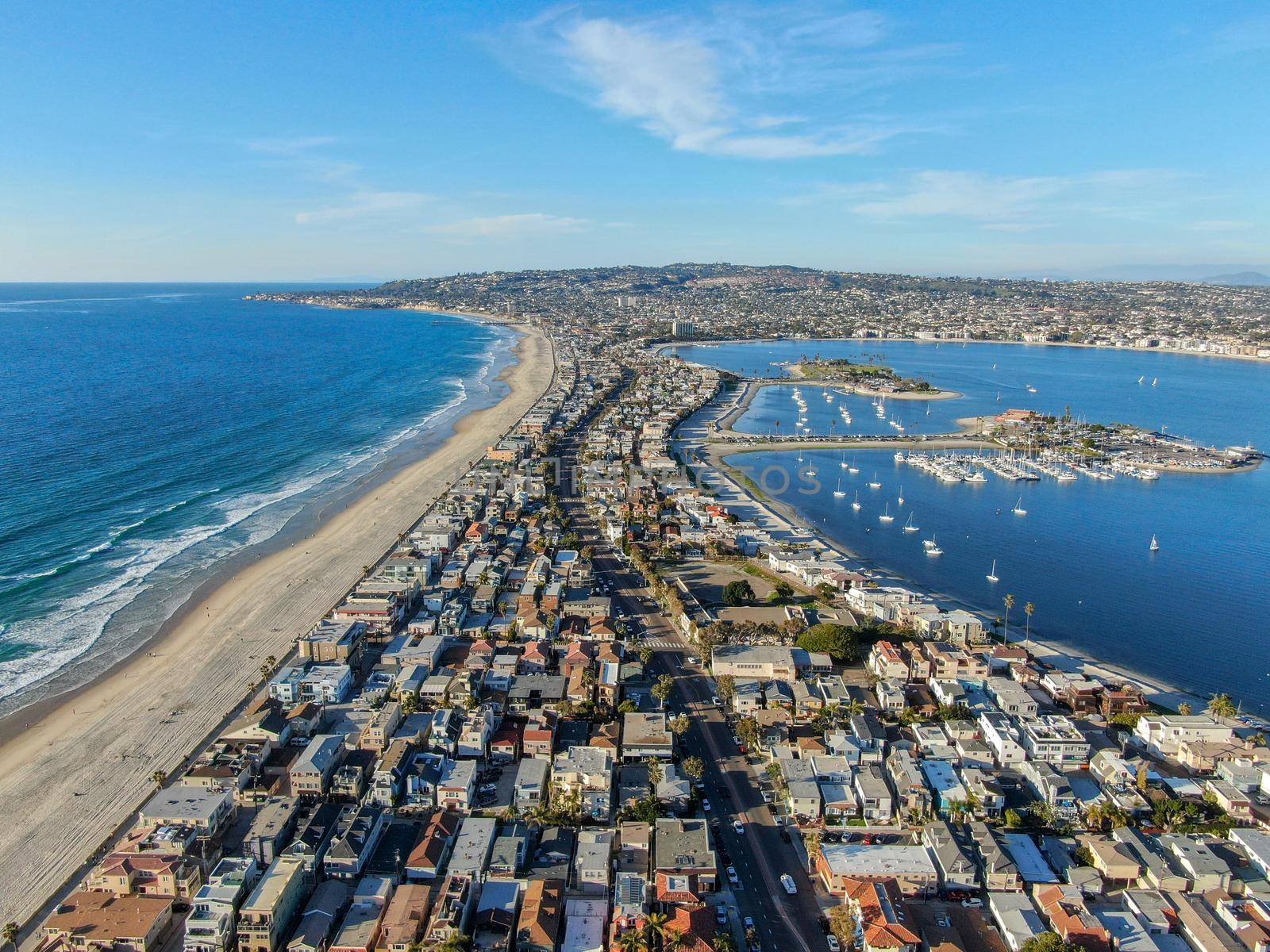Aerial view of Mission Bay and Beaches in San Diego, California. USA. Community built on a sandbar with villas, sea port and recreational Mission Bay Park. Californian beach lifestyle.