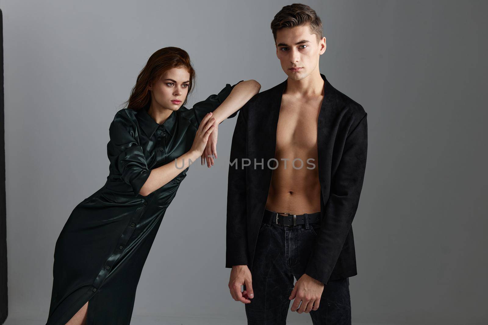 A beautiful woman is leaning on the shoulder of a sexy man in a suit by SHOTPRIME