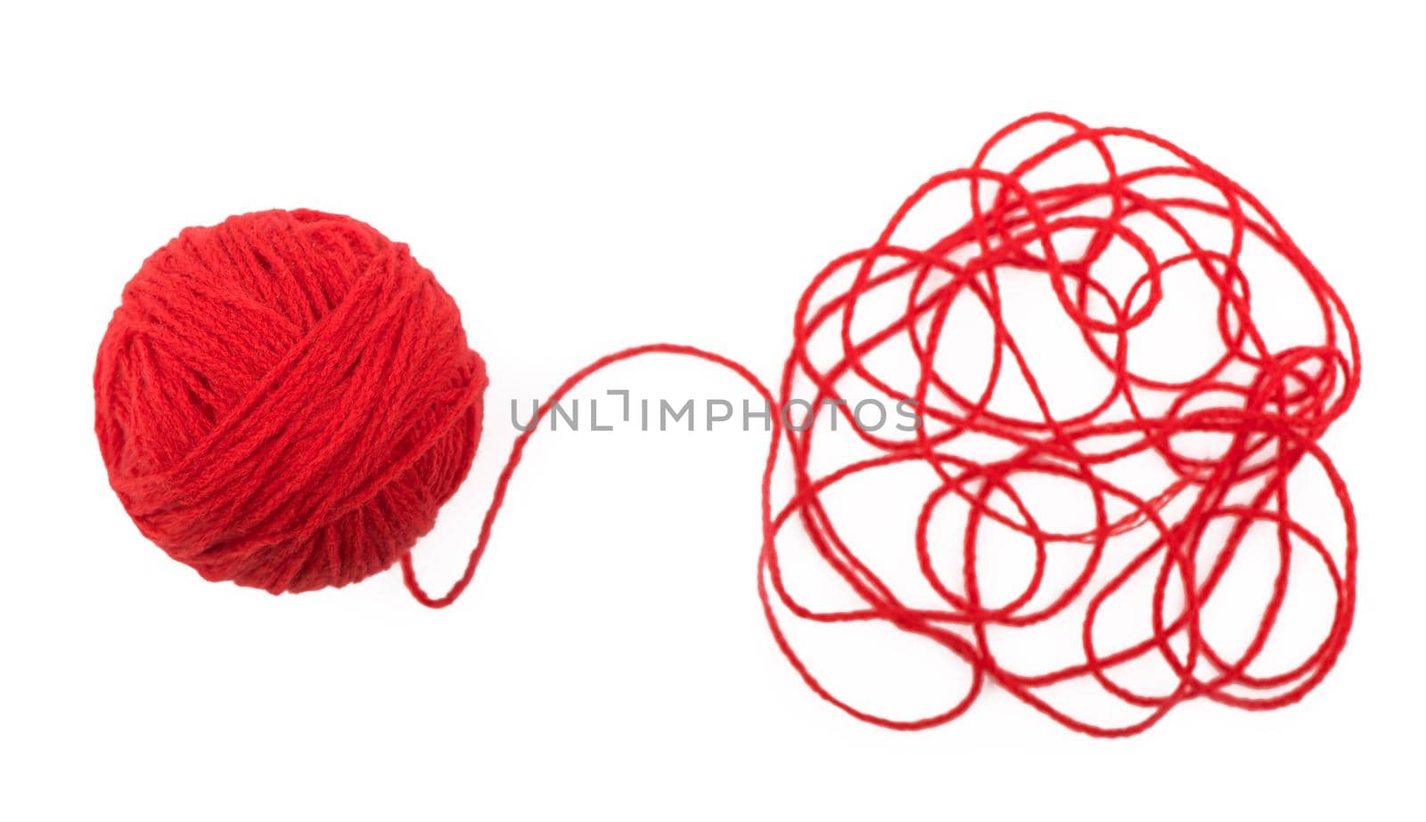 The idea is a tangled thread. Red ball of yarn on white background