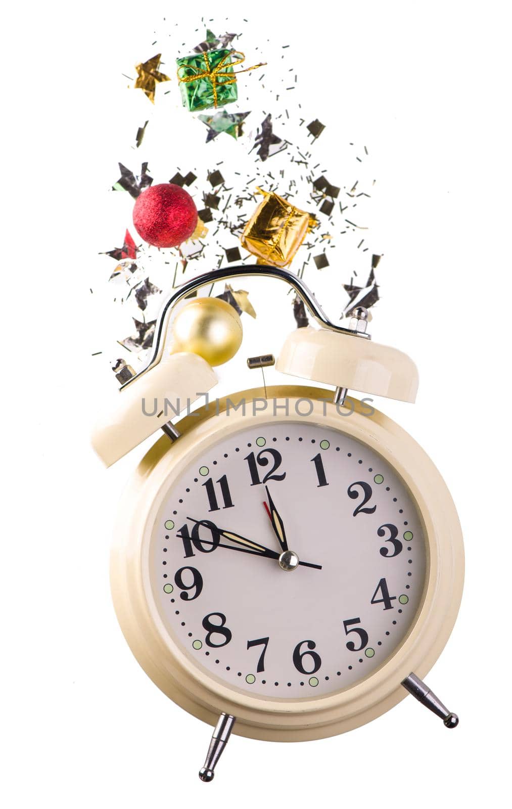 Christmas or New Year composition with retro alarm clock and Christmas decorations - stars, confetti, balls and gift boxes