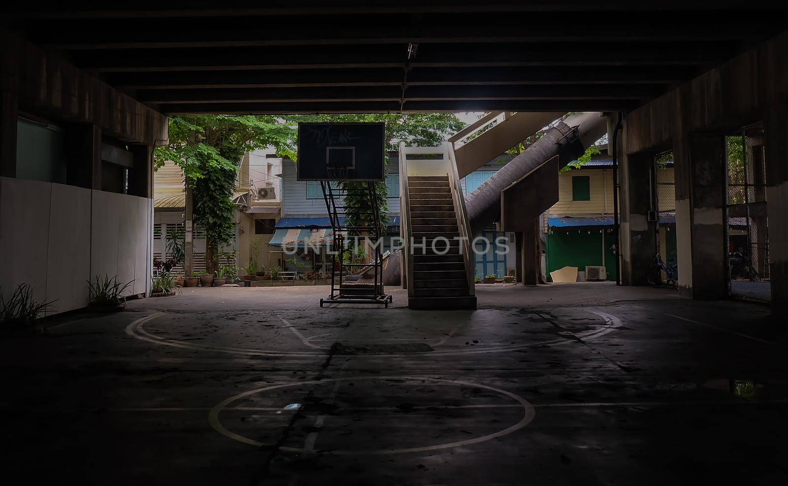 The old cement stairs leading down to the community basketball court under the bridge. No focus, specifically.
