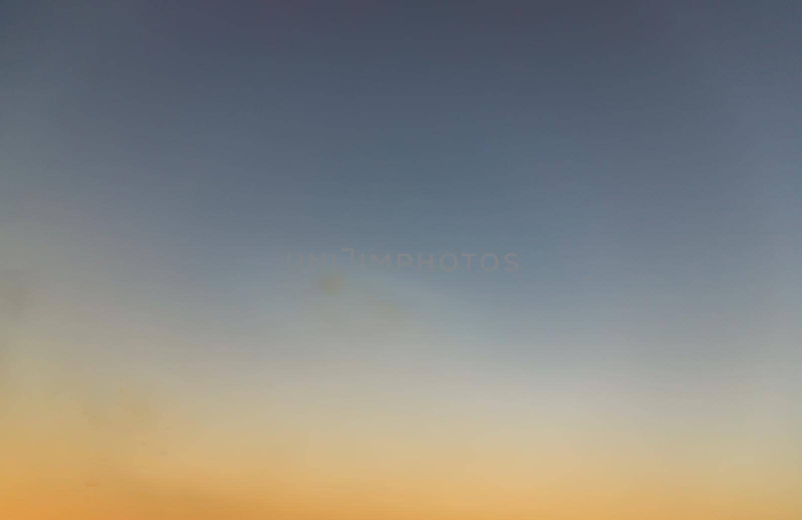 Background of blue and orange sky and empty space for your design. No cloud, No focus, specifically.