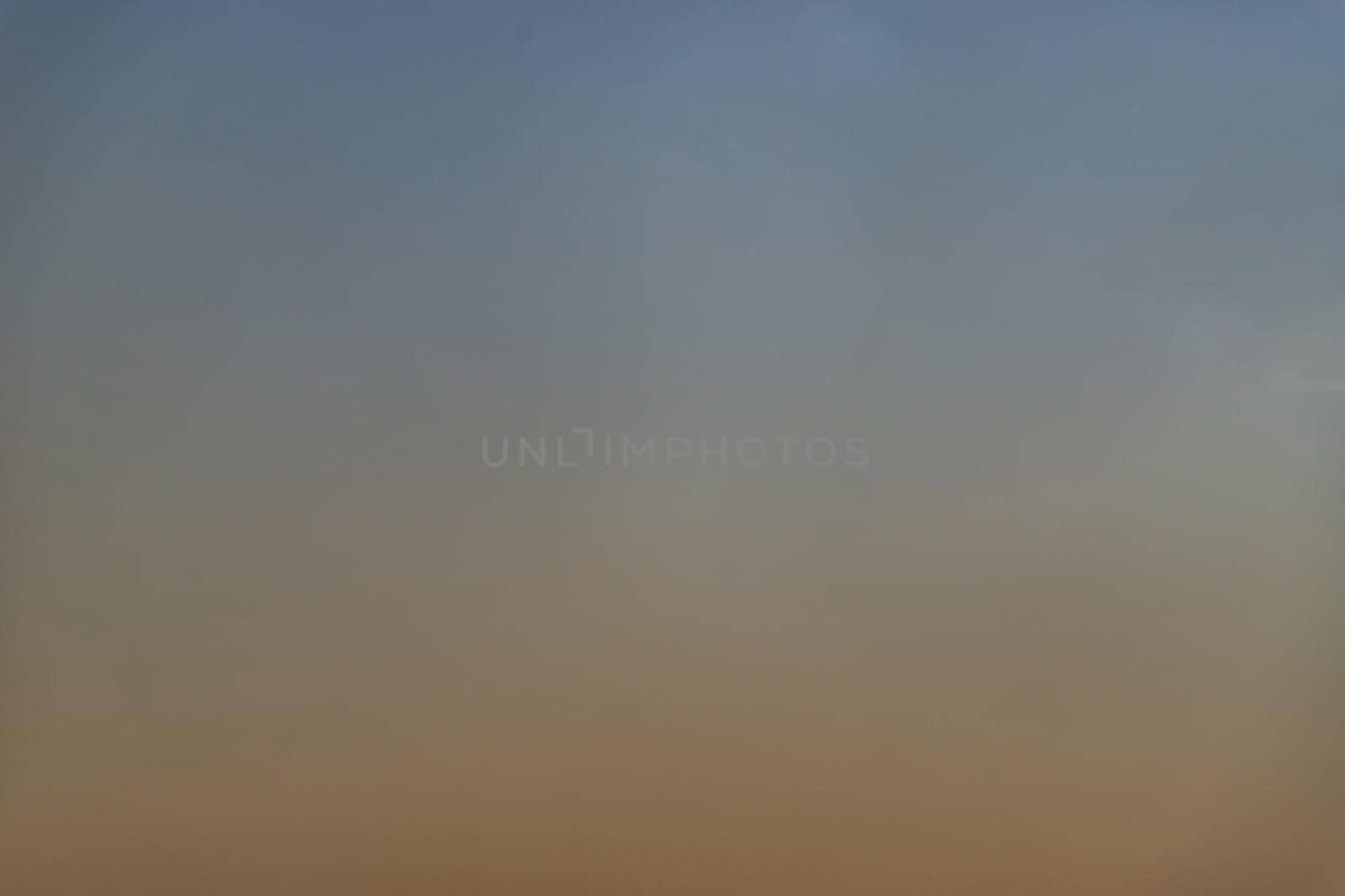 Background of blue and orange sky and empty space for your design. No cloud, No focus, specifically.