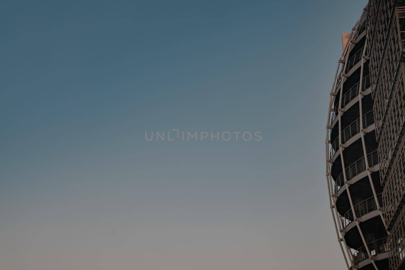 London, England - 20, Apr 2019 : Side view of Modern building metal structure on a background of blue sky. Bottom view, Copy space, No focus, specifically.