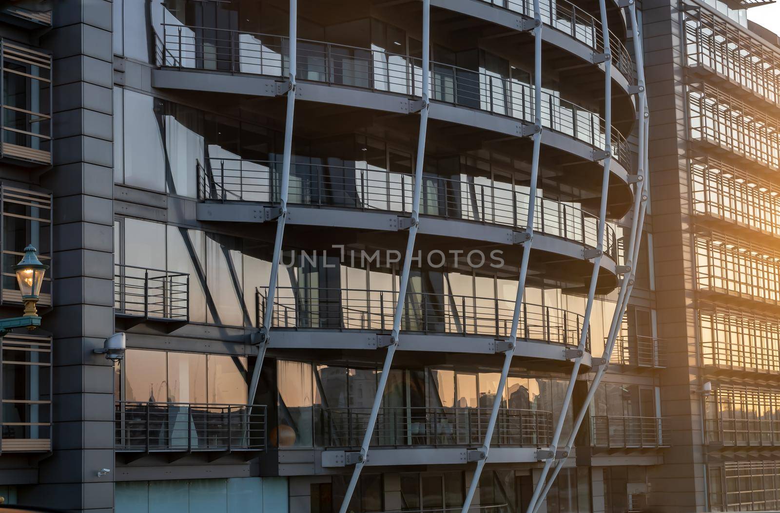 London, England - Apr 20, 2019 : Modern building with repeating structure and reflected sky and clouds. Architecture concept, No focus, specifically.