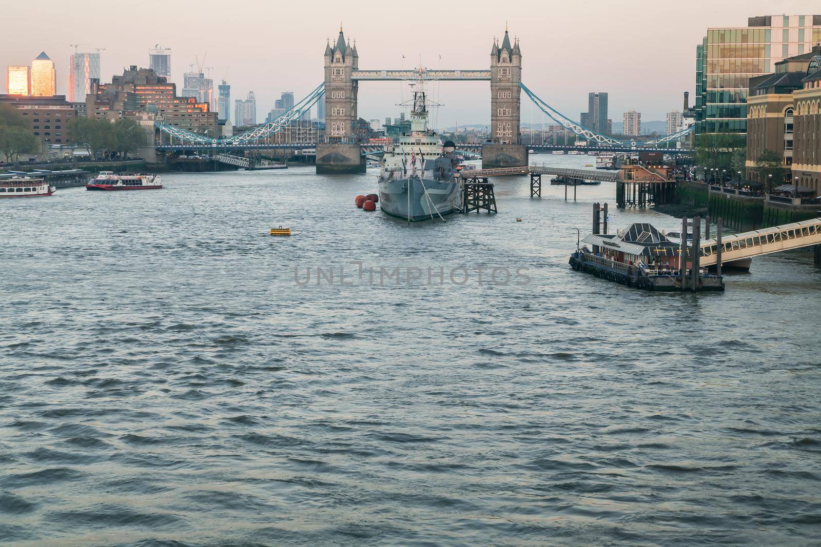 London, England - Apr 20, 2019 : HMS Belfast is a Town-class light cruiser that was built for the Royal Navy. She is now permanently moored as a museum ship in front of Tower Bridge on the River Thames, No focus, specifically.